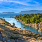 From a different perspective, the Corinth Canal reveals the full scale of its rock-cut gorge. An engineering marvel linking the Ionian Sea and the Aegean Sea.