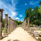 Among the columns of Olympia's Palaestra, athletes trained before the ancient Olympic Games. Here, the Olympic spirit was born and still inspires the world today.