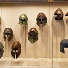 The bronze helmets displayed at the Archaeological Museum of Olympia tell the story of Greek warriors. Offered to the gods, they preserve centuries of history and tradition.
