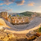Golden light embraces the Odeon of Herodes Atticus, where the ancient stone tiers still seem to await voices and applause. In this timeless setting, Athens reveals its enduring soul.