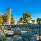 The lone standing column of the Temple of Zeus recalls the grandeur of ancient Olympia. Here stood one of the Seven Wonders of the Ancient World, dedicated to the king of the gods.