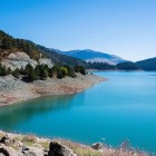 The turquoise waters of Aoos Springs Lake, in Pindus National Park, mirror the mountains of Epirus, creating one of Greece's most breathtaking natural landscapes.