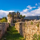The walls of Ioannina's ancient Byzantine Castle lead to Ali Pasha's Palace and the Bohemond Tower, enduring landmarks that preserve centuries of history.