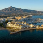 Puerto Banús unfolds from above with luxury yachts, turquoise waters and elegant Mediterranean architecture. Majestic La Concha completes Marbella's spectacular coastal panorama.