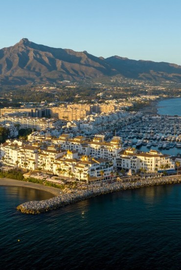 Puerto Banús unfolds from above with luxury yachts, turquoise waters and elegant Mediterranean architecture. Majestic La Concha completes Marbella's spectacular coastal panorama.