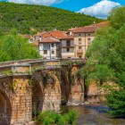 Along the Camino de Santiago, Covarrubias captivates visitors with the San Pablo Bridge over the Arlanza River, where Baroque charm enhances one of Castile's most authentic villages.