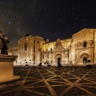 The Royal Basilica of San Isidoro in León shines beautifully at night, highlighting its remarkable Romanesque architecture in the historic heart of the city.