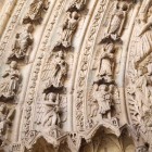 The tympanum of the Portico of Saint Francis at León Cathedral is a masterpiece of Gothic sculpture, adorned with sacred figures and exquisitely carved stone details.