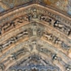 The portal of León Cathedral reveals a masterpiece of Gothic sculpture, where richly carved arches depict biblical figures and centuries of artistic and spiritual heritage.
