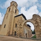The ruins of the Monastery of San Benito stand beside the elegant tower of the Church of San Tirso in Sahagún, reflecting centuries of history on the Camino de Santiago.
