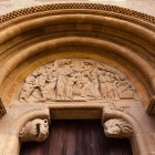 The Puerta del Cordero at the Royal Basilica of San Isidoro in León is a masterpiece of Spanish Romanesque art, featuring a richly carved tympanum with biblical scenes.