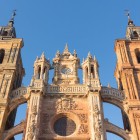 Low-angle view of León Cathedral, where its elegant towers and magnificent Gothic façade rise towards the sky, an enduring symbol of the Camino de Santiago.