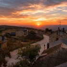 Sunset bathes Foncebadón in golden and orange hues, creating a breathtaking atmosphere along one of the most memorable stretches of the Camino de Santiago.