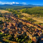 Aerial view of Castrillo de los Polvazares, a charming village in Castile and León, with stone houses, terracotta rooftops and landscapes along the Camino de Santiago.