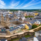Aerial view of Lugo's historic centre, dominated by the Cathedral of Saint Mary and its impressive UNESCO-listed Roman walls, among Galicia's most iconic landmarks.