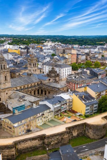 Aerial view of Lugo's historic centre, dominated by the Cathedral of Saint Mary and its impressive UNESCO-listed Roman walls, among Galicia's most iconic landmarks.