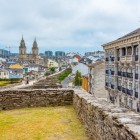 Walking along Lugo's UNESCO-listed Roman walls, the view opens onto the Cathedral of Saint Mary and the rooftops of the historic centre in the heart of Galicia.
