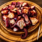 The famous pulpo á feira is the signature dish of Melide's Galician cuisine, an iconic stop on the Camino de Santiago, where tradition and flavor delight every pilgrim.