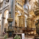 The interior of the Cathedral of Santiago de Compostela blends the solemnity of its Romanesque naves with the richness of its Baroque high altar, the spiritual heart of the Camino de Santiago.