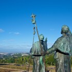 The Monte do Gozo pilgrim statues point toward the long-awaited destination. From here, pilgrims catch their first glimpse of the towers of Santiago de Compostela Cathedral, now only about an hour's walk away