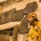 The Prophet Ezekiel welcomes pilgrims inside the Holy Door of Santiago de Compostela Cathedral, surrounded by biblical symbolism and finely carved details.