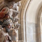 A detail of the Portico of Glory reveals the famous polychrome statues carved by Master Mateo, a masterpiece of Romanesque art in Santiago Cathedral.