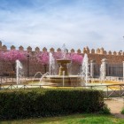 The elegant Plaza Adolfo Suárez draws the eye to the imposing medieval walls of Ávila, with the Cathedral of the Saviour rising beyond, a symbol of this UNESCO World Heritage city.