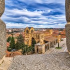 From the ancient medieval walls of Ávila, the view opens onto the Cathedral of the Saviour, a remarkable Romanesque-Gothic masterpiece overlooking the UNESCO-listed historic centre.
