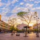 Framed by historic arcades and elegant façades, Segovia's Plaza Mayor welcomes visitors with a timeless atmosphere, enhanced by the warm light of sunset.