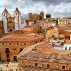 Above the tiled rooftops of Cáceres' historic center rise the Co-Cathedral of Santa María and its ancient noble towers, symbols of this UNESCO World Heritage city in Extremadura.
