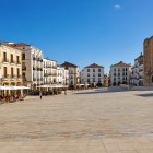 Plaza Mayor in Cáceres opens wide and bright, framed by arcaded buildings and dominated by the Torre de Bujaco, a medieval symbol of Extremadura’s UNESCO-listed historic centre.