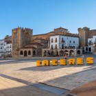 Plaza Mayor in Cáceres offers a view of the Torre de Bujaco and the ancient walls, gateway to the UNESCO-listed historic centre in the heart of Spanish Extremadura.
