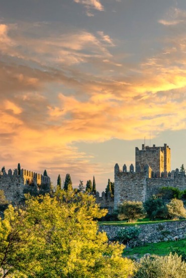 The city of Trujillo stretches across the Extremadura landscape, dominated by its Islamic castle with robust defensive walls, crenellated towers and ancient wall walks.