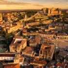Trujillo unfolds from above with its Renaissance Plaza Mayor, noble palaces and Islamic castle, connected to the ancient city walls by medieval towers and wall walks.