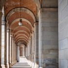 In the Royal Palace portico, granite columns and brick vaults converge towards a single vanishing point, creating a striking classical perspective.