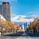 Strong perspectives and rows of trees lead the eye along Paseo de la Castellana, Madrid’s financial axis, where boulevards and skyscrapers define the modern city.