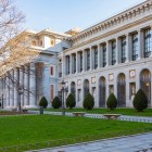 The Prado Museum’s side façade extends arcades and Neoclassical pilasters along the garden; the regular rhythm of the stone reveals Villanueva’s Enlightenment design.