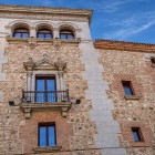 Casa de Cisneros, a Plateresque palace dating from 1537, combines masonry, brick and granite; balconies, carved frames and an upper loggia evoke Renaissance Madrid.