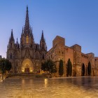 Pla de la Seu offers one of the most evocative views in the Gothic Quarter: the Cathedral of the Holy Cross and Saint Eulalia dominates the square with its Neo-Gothic façade, spires and medieval walls.