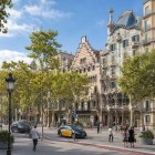 Passeig de Gràcia blends shopping and Modernisme: Casa Amatller and Casa Batlló rise along the tree-lined avenue, symbols of the architectural elegance of Barcelona’s Eixample.