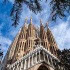The Nativity Façade welcomes visitors with three portals dedicated to Faith, Hope and Charity, crowned by perforated towers expressing Gaudí’s naturalistic vision.