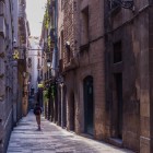 In the maze of the Gothic Quarter, a narrow street follows the medieval layout past stone doorways, wrought-iron balconies and shadowy passages, revealing Barcelona at its oldest and most authentic.