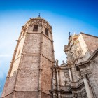 El Miguelete dominates Valencia Cathedral with its 14th-century octagonal Gothic tower; beside it, the Baroque façade of the Iron Gate enriches the monumental skyline.