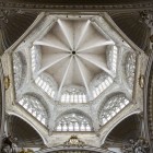 The octagonal dome of Valencia Cathedral rises above the transept with star-shaped vaults and large mullioned windows, filling this Valencian Gothic masterpiece with natural light.
