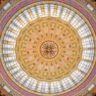 The dome of Valencia’s Central Market enchants with stained glass, ceramics and geometric motifs: an elegant modernist feature spreading light and colour throughout the market.