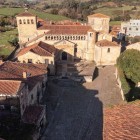 From above, the Collegiate Church of Santa Juliana dominates Santillana del Mar with its Romanesque architecture. A national monument since 1889, it gave the town its name.