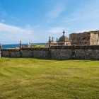 On the coast of Comillas, Domènech i Montaner’s Modernist cemetery blends Gothic ruins, stone walls and pinnacles, dominated by Llimona’s striking Ángel Exterminador.