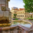 In Plaza de San Juan, the stone fountain leads towards the former Pilgrims’ Hospital, now a library: a corner of Burgos where architecture meets the Camino de Santiago.