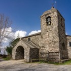 A square bell tower and stone portico define the austere profile of Santa María A Real, a pilgrims’ refuge in O Cebreiro and guardian of the Holy Grail chalice.