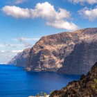 The imposing Los Gigantes cliffs rise above the Atlantic, surrounded by volcanic rocks, deep-blue waters and the wild scenery of Tenerife’s western coast.